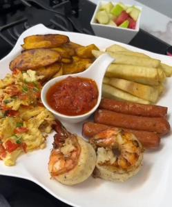 a white plate of food with shrimp and other foods at Pious Court in Port Harcourt