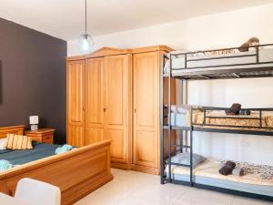 a room with two bunk beds and a cabinet at XL Central Home - Sleeps 10 people in Pieta
