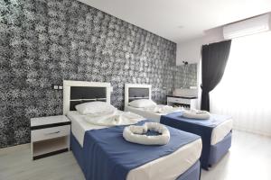 Postel nebo postele na pokoji v ubytování La Rezidans Hotel + 16 fotografií
