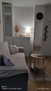 a living room with a couch and a table at Apartament CullerA in Cullera