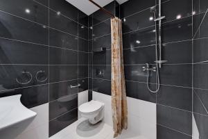 Kúpeľňa v ubytovaní Dom & House - Apartamenty Sunrise