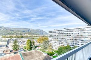 a view from the balcony of a apartment building at Superbe : parking gratuit + fibre wifi + balcon in Grenoble