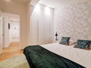 Ένα ή περισσότερα κρεβάτια σε δωμάτιο στο Zarautz Bella Suite by Aston Rentals