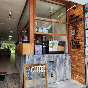 a coffee shop with a sign in front of it at The Palace Aonang Resort in Ao Nang Beach
