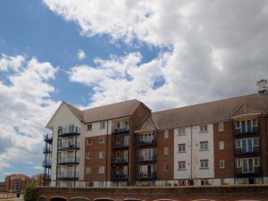 an apartment building with a sky in the background at Harbour View in Pevensey