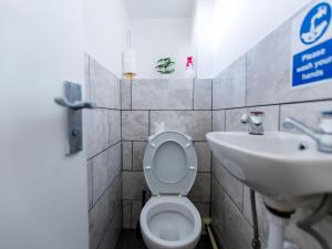 a bathroom with a toilet and a sink at 3 bedrooms House with nice park view in Thamesmead