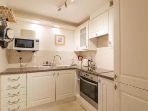 Kjøkken eller kjøkkenkrok på Tweed Apartment