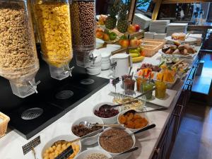 a buffet with many different types of food on a table at Pollera in Kraków