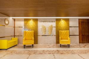 Posezení v ubytování Poppys Pleasant Stay