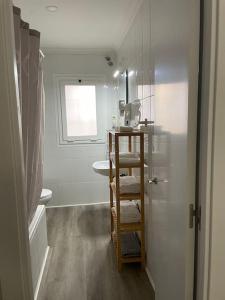 a bathroom with a shower and a sink and a toilet at Holiday home Salou in Salou