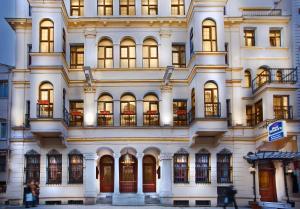 a large white building with a lot of windows at Amber Hotel & Spa in Istanbul