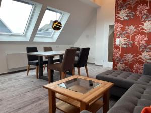 a living room with a couch and a table at Astrid's Appartements in Winterberg