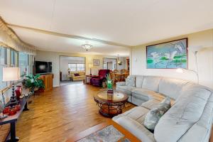 a living room with a couch and a table at Sunny Skies in Leesburg