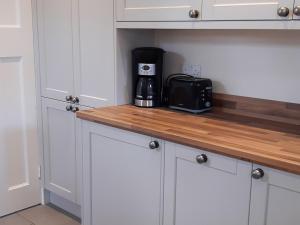a kitchen with a counter with a coffee maker on it at Melville in Bakewell