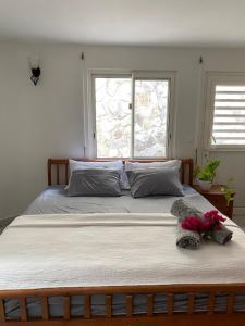 Ein Bett oder Betten in einem Zimmer der Unterkunft Grand Case Palace