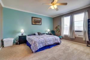 a bedroom with a bed and a ceiling fan at Spacious Hutto Retreat with Large Private Backyard in Hutto