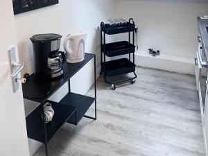 a room with a counter with a coffee maker at Comfy Apartment in Krefeld in Krefeld