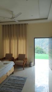 Ένα ή περισσότερα κρεβάτια σε δωμάτιο στο Hotel Anandam phata
