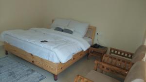 Postel nebo postele na pokoji v ubytování Hotel Anandam phata