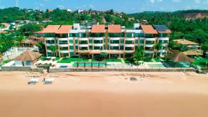 an aerial view of a resort on the beach at Waterfront Residence in Maceió