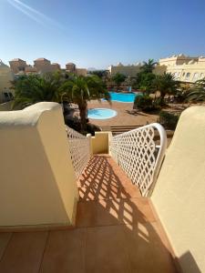 a stairway leading to a balcony with a pool at 60 El Sultan, 20 Pedroy Guy Vandaele in Corralejo