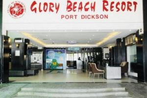 a lobby of a hotel with a sign for a resort at Cuti Cuti apartment Glory Beach in Port Dickson