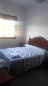 Casa La Cruz Pintá tesisinde bir odada yatak veya yataklar