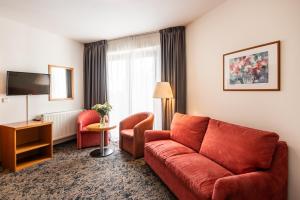 TV a/nebo společenská místnost v ubytování Hotel Troja