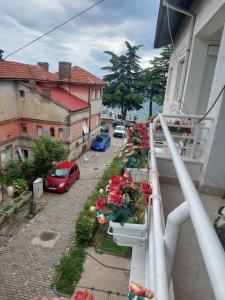 a balcony with flowers on the side of a house at Villa Greta Pipile in Ohrid