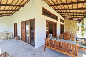 Khu vực ghế ngồi tại Chalés em Jericoacoara por Carpediem