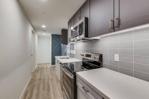 a kitchen with a stove and a counter top at Luxury Furnished Studio Suite in Lake Merritt in Oakland