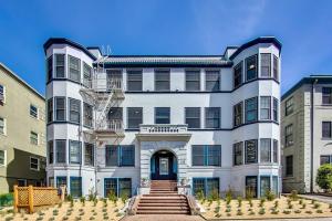 a large white building with stairs in front of it at Luxury Furnished Studio Suite in Lake Merritt in Oakland
