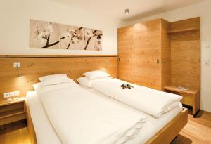 Postel nebo postele na pokoji v ubytování Das Tannberg