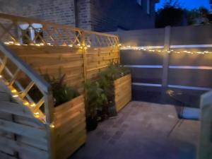 a patio with a staircase with lights on it at Hallo Maastricht B&B Fientje in Maastricht