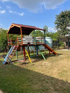 a park with a playground with a roof and stairs at Apartamento em condomínio Belém in Belém