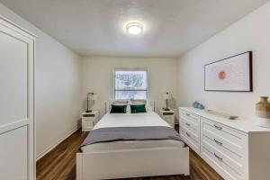 a white bedroom with a bed and a window at 2BR in Berkeley Near Campus in Berkeley