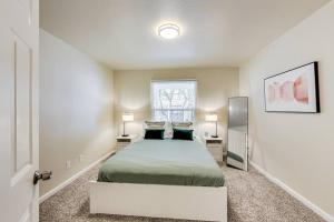 a bedroom with a bed with two pillows on it at 2BR in Berkeley Near Campus in Berkeley