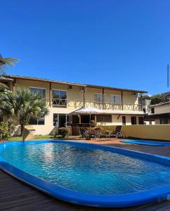 a large swimming pool in front of a building at Pousada Oceano Atlântico in Barra Grande
