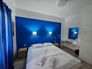 En eller flere senge i et værelse på Corfu Dream Holidays Villas Standart