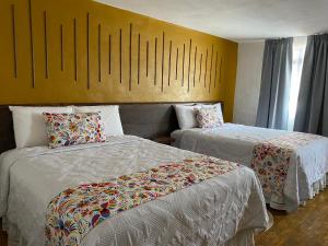 Postel nebo postele na pokoji v ubytování PASEO REAL HOTEL BOUTIQUE
