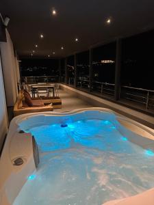 a jacuzzi tub on the balcony of a building at Complex Rediu 54 - Penthouse Nr. 41 in Iaşi