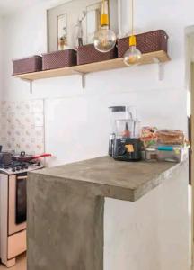 a kitchen with a counter top and a stove at Beach Apartment in Tel Aviv