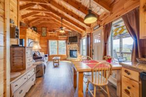 a dining room and kitchen in a log cabin at Journey's End in Gatlinburg