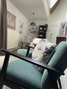 a living room with a couch and a table at Guesthouse de Loft in Bruges