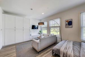 a bedroom with a bed and a desk and a window at Private Luxury Studio in Lake Merritt in Oakland