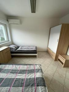 Postel nebo postele na pokoji v ubytování Ubytování Pardubice Trnová