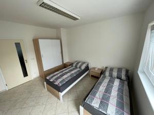 Postel nebo postele na pokoji v ubytování Ubytování Pardubice Trnová