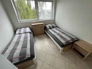 Postel nebo postele na pokoji v ubytování Ubytování Pardubice Trnová