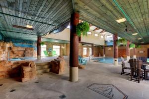 a large room with a swimming pool in a house at Stoney Creek lnn Galena in Galena