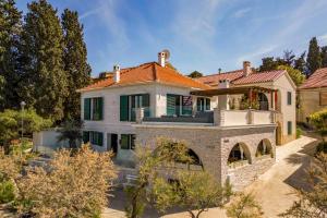 a house with a red roof at Villa Mare Vista in Žman